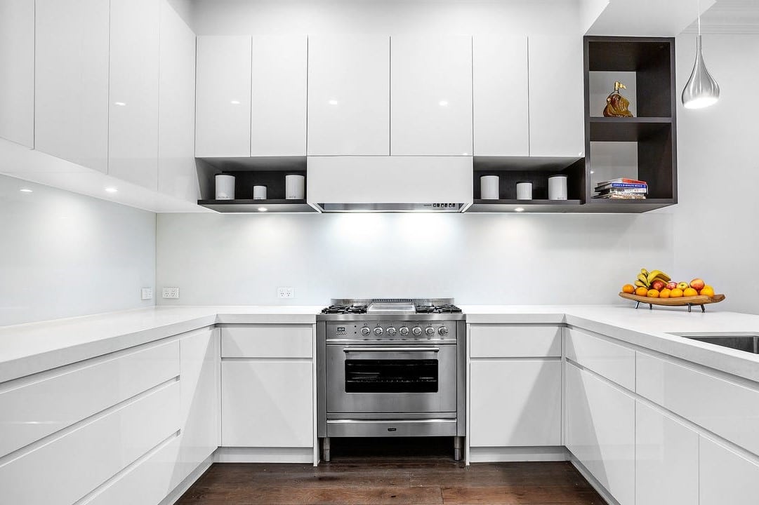 a kitchen with white cabinets