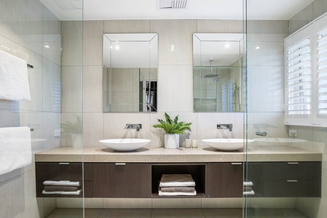 a bathroom with a large mirror