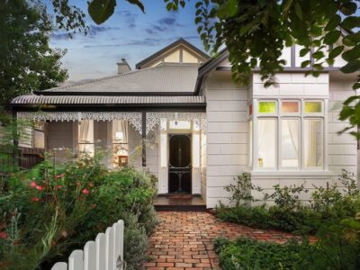 a house with a white fence