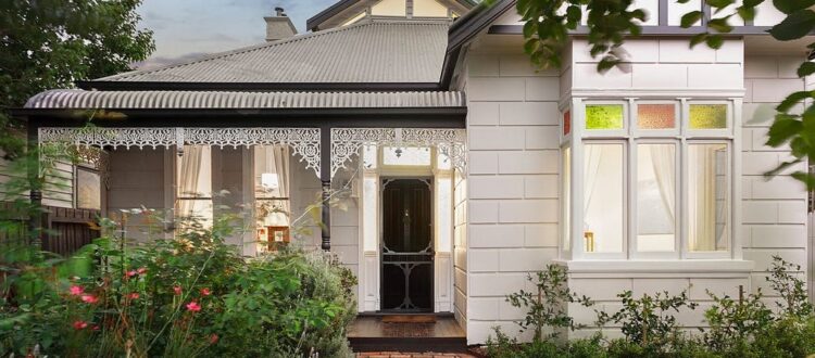 a house with a white fence