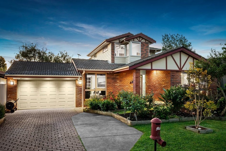 a house with a brick driveway