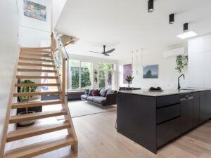 a room with a staircase and a wood floor