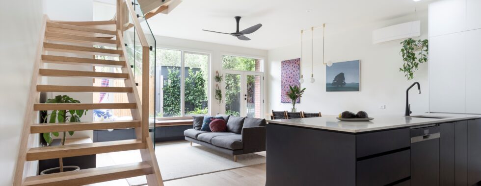 a room with a staircase and a wood floor