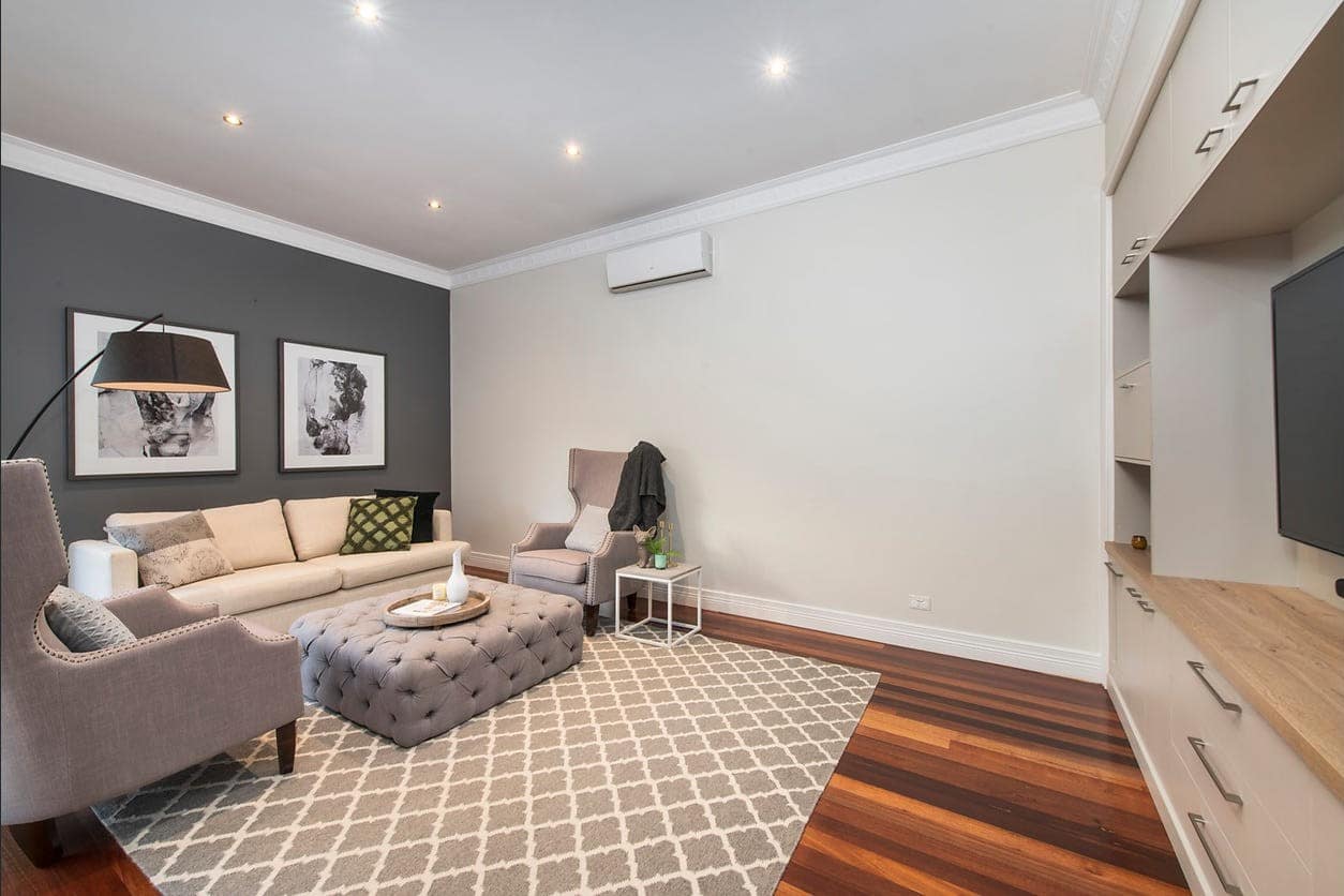 a living room with a couch and a tv