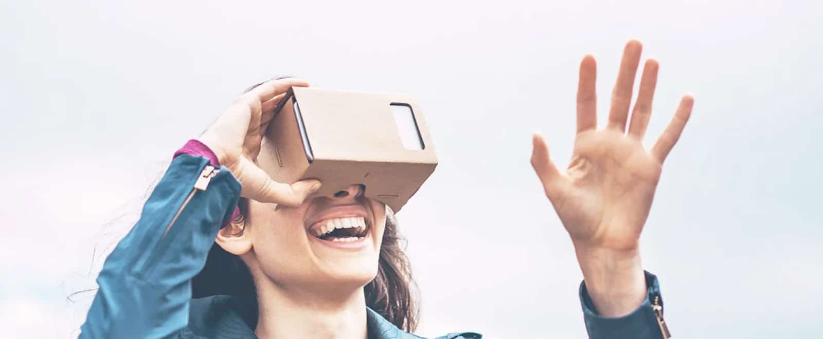 a person wearing a mask and holding a box to the head