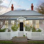 a house with a white picket fence