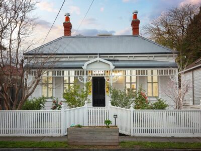 a house with a white picket fence