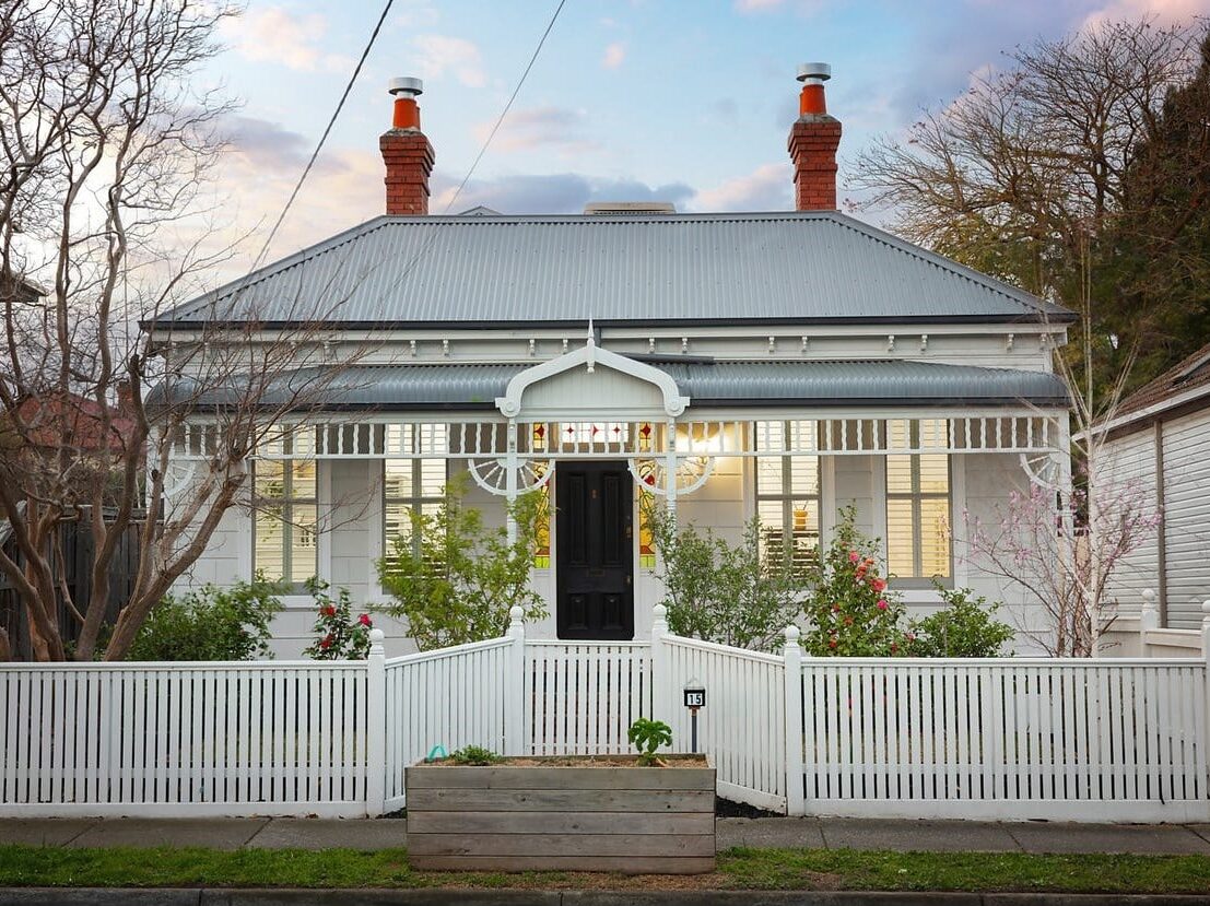 a house with a white picket fence