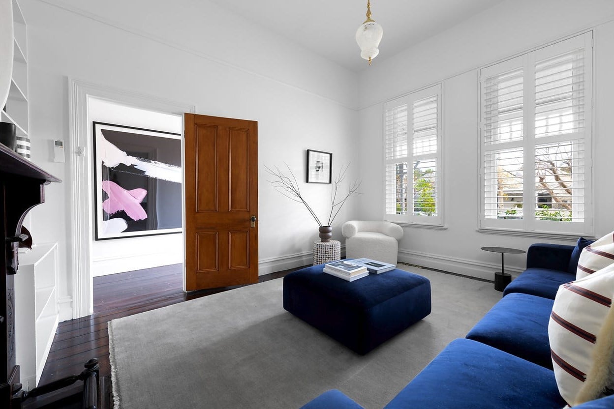 a living room with a blue couch and a blue couch