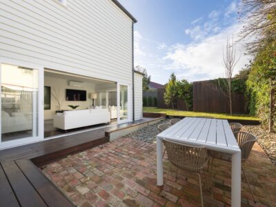 a backyard with a table and chairs
