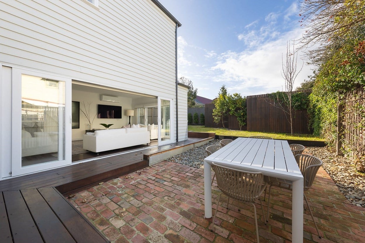 a backyard with a table and chairs