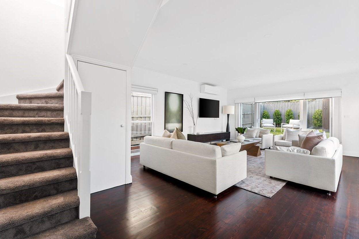 a living room with a staircase