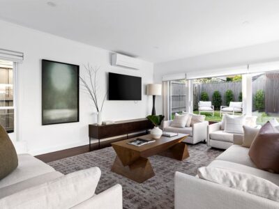 a living room with a tv and couches
