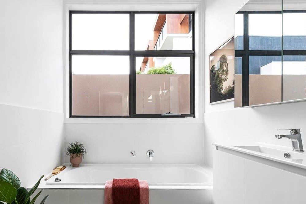 a bathroom with a tub and sink