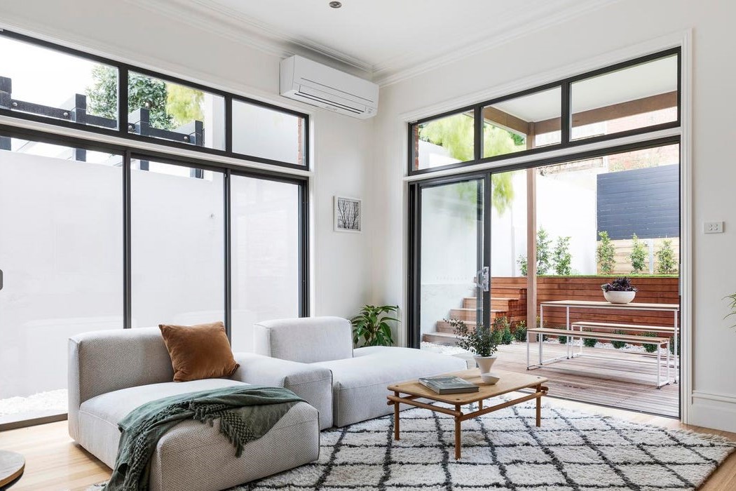 a living room with a large glass door