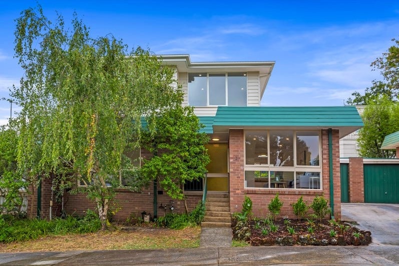 a house with trees in the front