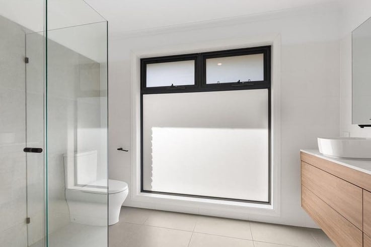 a bathroom with a glass shower