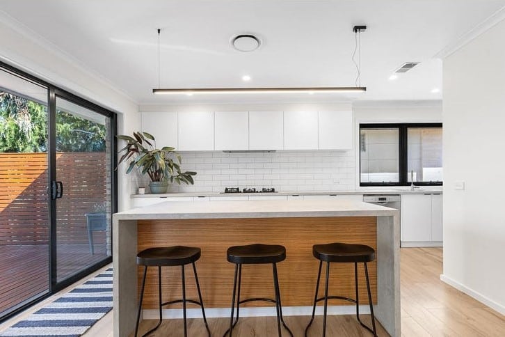 a kitchen with a table and chairs