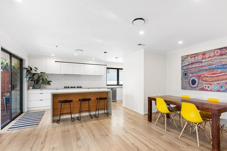 a kitchen with a table and chairs