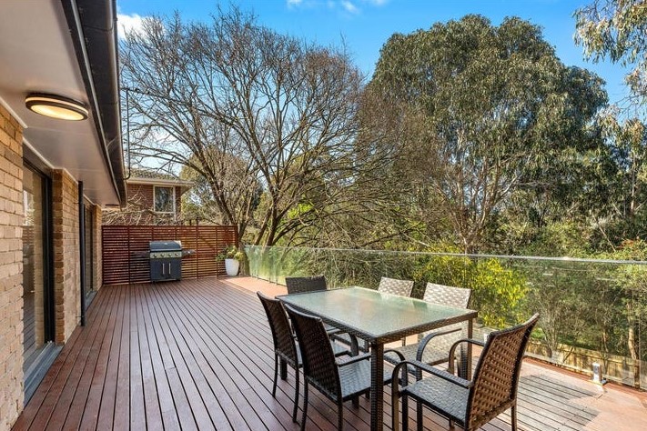 a table and chairs on a deck