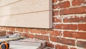 How to Add a Weatherboard Extension to Your Brick House?